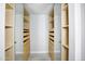 Spacious walk-in closet with built-in shelving and drawers for organized storage at 1806 W Rosewood Ct, Chandler, AZ 85224
