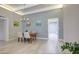Bright dining room with wood table, seating for four, modern lighting, and neutral walls at 1806 W Rosewood Ct, Chandler, AZ 85224