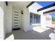 Welcoming front porch with modern door design, stylish lighting, and decorative architectural details at 1806 W Rosewood Ct, Chandler, AZ 85224