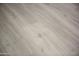 Stylish grey wood-look flooring that creates a modern, sleek aesthetic for any space in the home at 1806 W Rosewood Ct, Chandler, AZ 85224