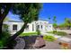 Charming home with desert landscaping, stone accents, and a well-maintained yard at 1806 W Rosewood Ct, Chandler, AZ 85224