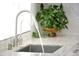 Close-up of a modern kitchen sink with granite countertops, perfect for a gourmet experience at 1806 W Rosewood Ct, Chandler, AZ 85224