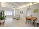Open living room with sleek sofa, modern lighting, and decorative plant near dining area at 1806 W Rosewood Ct, Chandler, AZ 85224