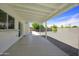 Covered patio with an extended gravel area, offers ample space for outdoor entertaining and relaxation at 1806 W Rosewood Ct, Chandler, AZ 85224