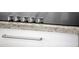 Black stovetop on granite countertop at 1806 W Rosewood Ct, Chandler, AZ 85224