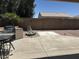 Backyard with built-in grill and water feature at 18131 W Addie Ln, Surprise, AZ 85374