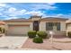 Charming single-story home features low-maintenance landscaping, tile roof, and two car garage at 18131 W Addie Ln, Surprise, AZ 85374