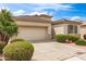 Charming single-story home features low-maintenance landscaping, tile roof, and two car garage at 18131 W Addie Ln, Surprise, AZ 85374
