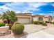 Charming single-story home features low-maintenance landscaping, tile roof, and two car garage at 18131 W Addie Ln, Surprise, AZ 85374