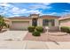 Charming single-story home features low-maintenance landscaping, tile roof, and two car garage at 18131 W Addie Ln, Surprise, AZ 85374