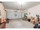 Spacious garage with ample storage, including cabinets, and an automated door mechanism at 18131 W Addie Ln, Surprise, AZ 85374