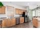 Kitchen area featuring stainless steel appliances and light wood cabinetry at 18131 W Addie Ln, Surprise, AZ 85374