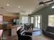 Open-concept living space featuring a kitchen, dining area, and living room perfect for gatherings and entertainment at 18131 W Addie Ln, Surprise, AZ 85374