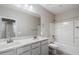 Bright bathroom featuring a double vanity with a shower-tub combo at 1823 E Chelsea Ln # 106, Gilbert, AZ 85295