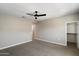 Spacious carpeted bedroom with neutral walls and a modern ceiling fan at 1823 E Chelsea Ln # 106, Gilbert, AZ 85295