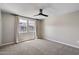 Carpeted bedroom with neutral walls and large windows covered by neutral curtains at 1823 E Chelsea Ln # 106, Gilbert, AZ 85295