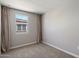 Bedroom featuring neutral walls and a window covered by neutral curtains at 1823 E Chelsea Ln # 106, Gilbert, AZ 85295
