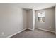 Carpeted bedroom featuring neutral walls and a window at 1823 E Chelsea Ln # 106, Gilbert, AZ 85295