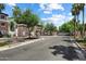 Community entrance with stone pillars and an iron gate at 1823 E Chelsea Ln # 106, Gilbert, AZ 85295