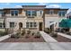 Charming townhome with beautiful stone accents and a well-manicured front yard at 1823 E Chelsea Ln # 106, Gilbert, AZ 85295