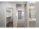 Upstairs hall with closet, views into bedroom and bathroom at 1823 E Chelsea Ln # 106, Gilbert, AZ 85295
