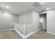 Brightly lit second-story hallway with neutral walls and carpeted floors at 1823 E Chelsea Ln # 106, Gilbert, AZ 85295