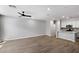 Expansive living room with hardwood floors that opens up to the kitchen at 1823 E Chelsea Ln # 106, Gilbert, AZ 85295