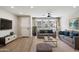 Bright living room boasts modern decor, wood floors, and plenty of natural light at 1823 E Chelsea Ln # 106, Gilbert, AZ 85295