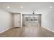 Bright, open living area with hardwood floors, a ceiling fan, and large windows at 1823 E Chelsea Ln # 106, Gilbert, AZ 85295
