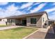 Inviting backyard with a cozy patio, lush lawn, and serene ambiance, ideal for relaxation and entertainment at 18929 W Windsor Blvd, Litchfield Park, AZ 85340