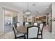 Breakfast nook features a modern chandelier and provides access to the backyard at 18929 W Windsor Blvd, Litchfield Park, AZ 85340