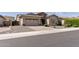 Charming home with a well-maintained front yard and a two-car garage at 18929 W Windsor Blvd, Litchfield Park, AZ 85340