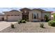 Charming single-story home with desert landscaping and a neutral color palette at 18929 W Windsor Blvd, Litchfield Park, AZ 85340