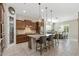 Modern kitchen offers center island with seating, stainless appliances, and updated lighting at 18929 W Windsor Blvd, Litchfield Park, AZ 85340