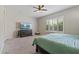Carpeted main bedroom provides plantation shutters for privacy and has a ceiling fan at 18929 W Windsor Blvd, Litchfield Park, AZ 85340