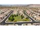 An aerial view of a neighborhood featuring a community park and well-planned street layout at 18929 W Windsor Blvd, Litchfield Park, AZ 85340