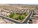 An aerial view of a neighborhood with a park, showing the layout and community features at 18929 W Windsor Blvd, Litchfield Park, AZ 85340
