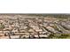 An aerial shot of a residential neighborhood with mature trees and desert landscaping at 18929 W Windsor Blvd, Litchfield Park, AZ 85340