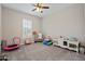Bright playroom features carpeted floors, abundant light, and plenty of space for play and activities at 18929 W Windsor Blvd, Litchfield Park, AZ 85340