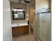Functional bathroom featuring a step-in shower, vanity with storage, and tiled flooring at 19139 N Alameda Dr, Surprise, AZ 85387