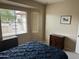 Bedroom with a window bay, natural light, artwork, and two side tables at 19139 N Alameda Dr, Surprise, AZ 85387