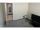 Spare bedroom with exercise equipment and an open doorway leading to other rooms at 19139 N Alameda Dr, Surprise, AZ 85387