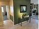 Green foyer with stylish decor and a peek into the adjacent living spaces at 19139 N Alameda Dr, Surprise, AZ 85387