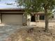 Charming single-story home featuring desert landscaping, a two-car garage, and a lovely entryway at 19139 N Alameda Dr, Surprise, AZ 85387