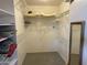 Well-organized walk-in closet with wire shelving, carpet, and a mirror at 19139 N Alameda Dr, Surprise, AZ 85387