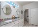 Well-lit bathroom with double sinks, granite countertops, and a separate toilet area at 19892 N Shadow Mountain Dr, Surprise, AZ 85374