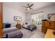 Comfortable bedroom with twin beds, neutral decor, and natural light from the shuttered window at 19892 N Shadow Mountain Dr, Surprise, AZ 85374