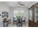 Cozy breakfast nook with a modern table set, bright windows, and a stylish display cabinet at 19892 N Shadow Mountain Dr, Surprise, AZ 85374