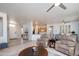 Bright living area with tile flooring, neutral walls, and an open floor plan leading to the kitchen at 19892 N Shadow Mountain Dr, Surprise, AZ 85374