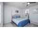 Comfortable main bedroom with a queen bed, soft lighting, and an ensuite bathroom at 19892 N Shadow Mountain Dr, Surprise, AZ 85374
